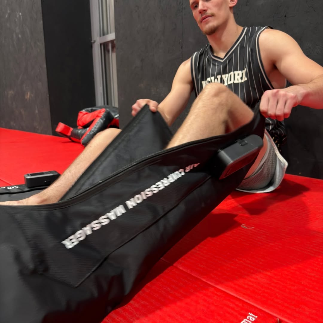 Athlete using air compression boots after training